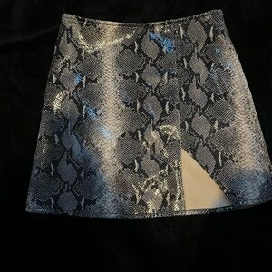 Motel Rocks snake print mini skirt.
